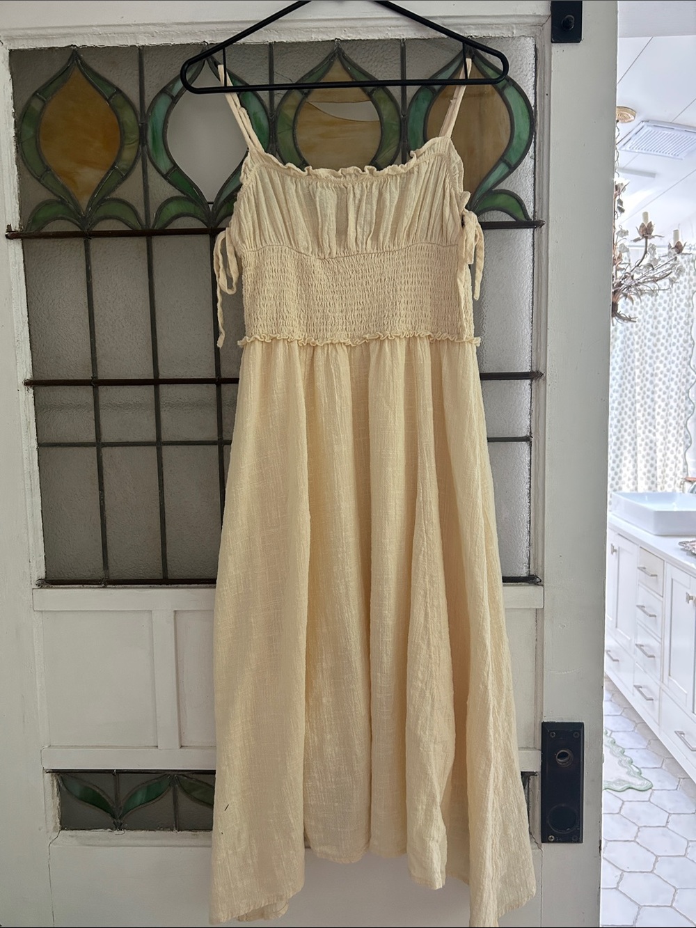 Urban Outfitters Cream Smocked Cotton dress with Ties on side at bodice.